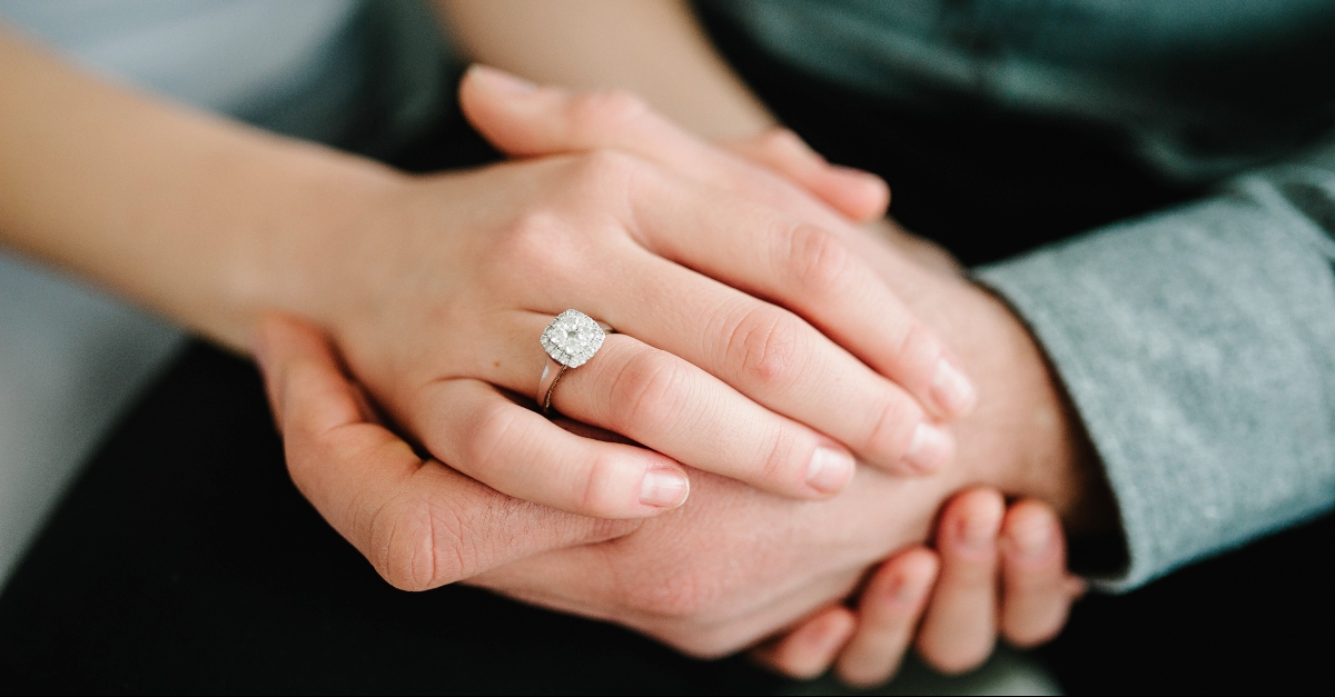 Husband and wifes hands clasped