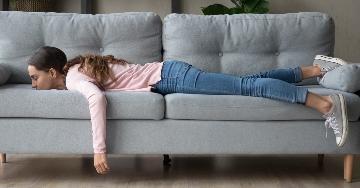 Lazy woman laying on a sofa
