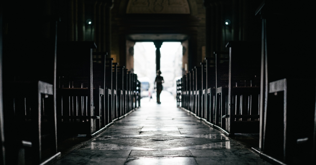 view down aisle of empty church and pews, warnings for christians asleep