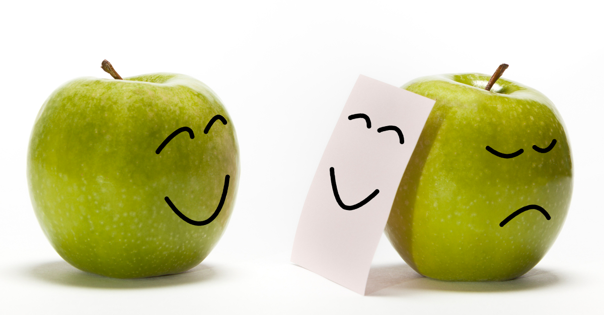 two apples one happy other pretending but sad