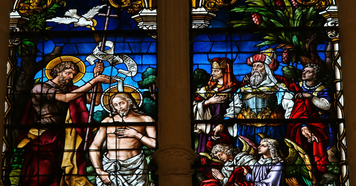 Stained glass window depicting the Baptism of Jesus by Saint John in the cathedral of Burgos, Castille, Spain