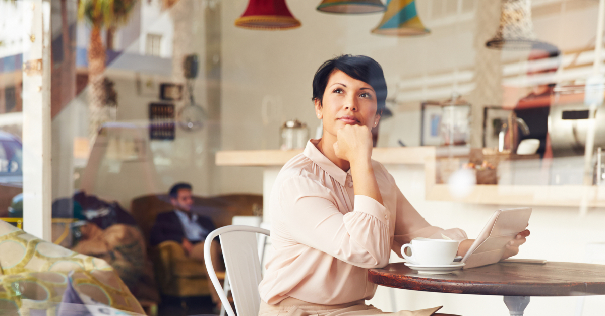 mature woman thinking in coffee shop, think about your spiritual gifts