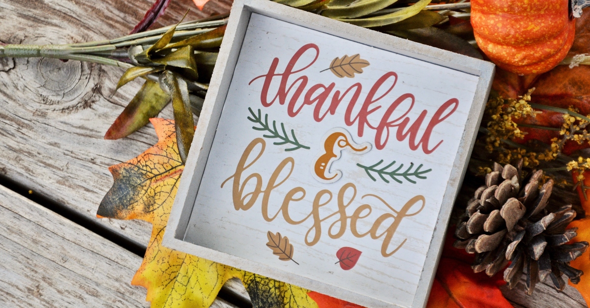 Artsy sign that says thankful and blessed, enter his gates with thanksgiving