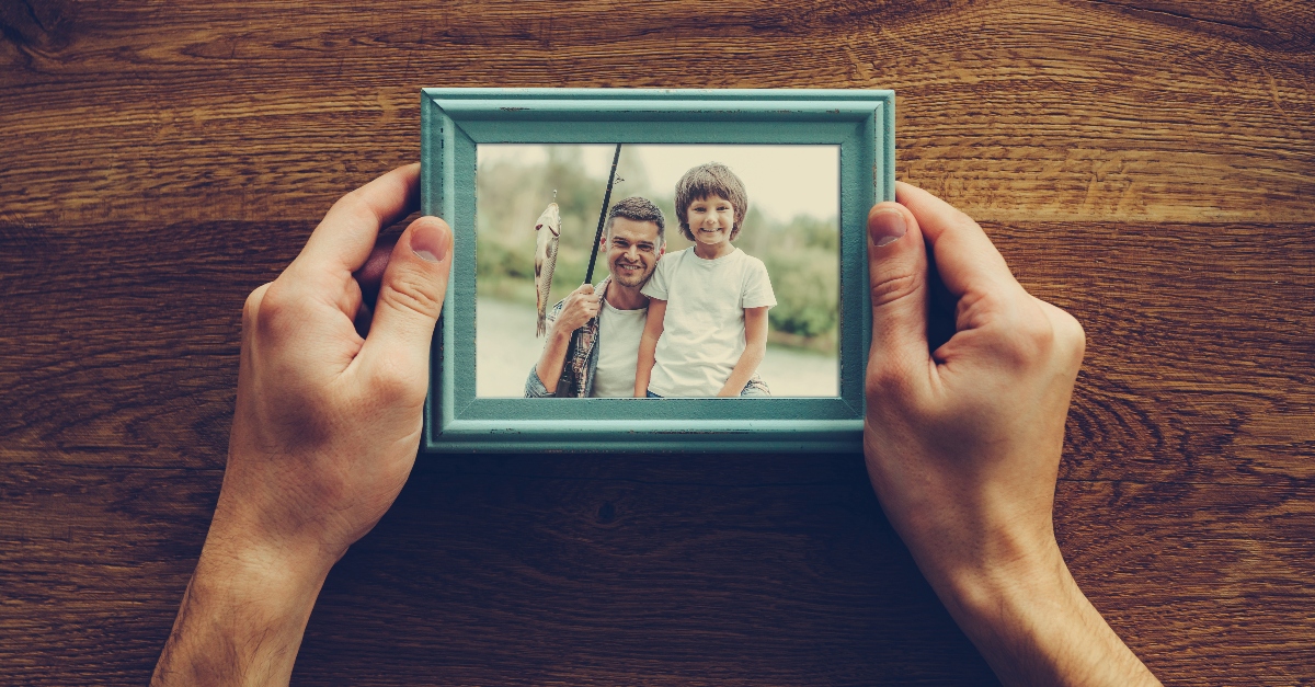 Grandparents holding pictures of son and grandchildren, how to deal with estrangement from children