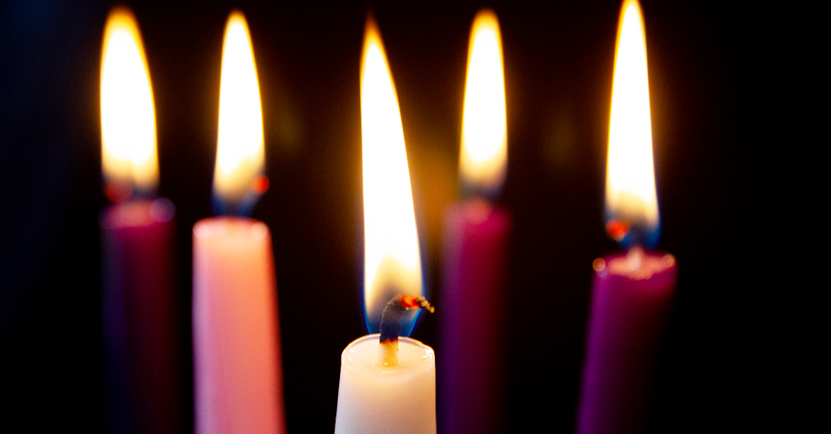 Inside the old fashioned library, a candle illuminated the