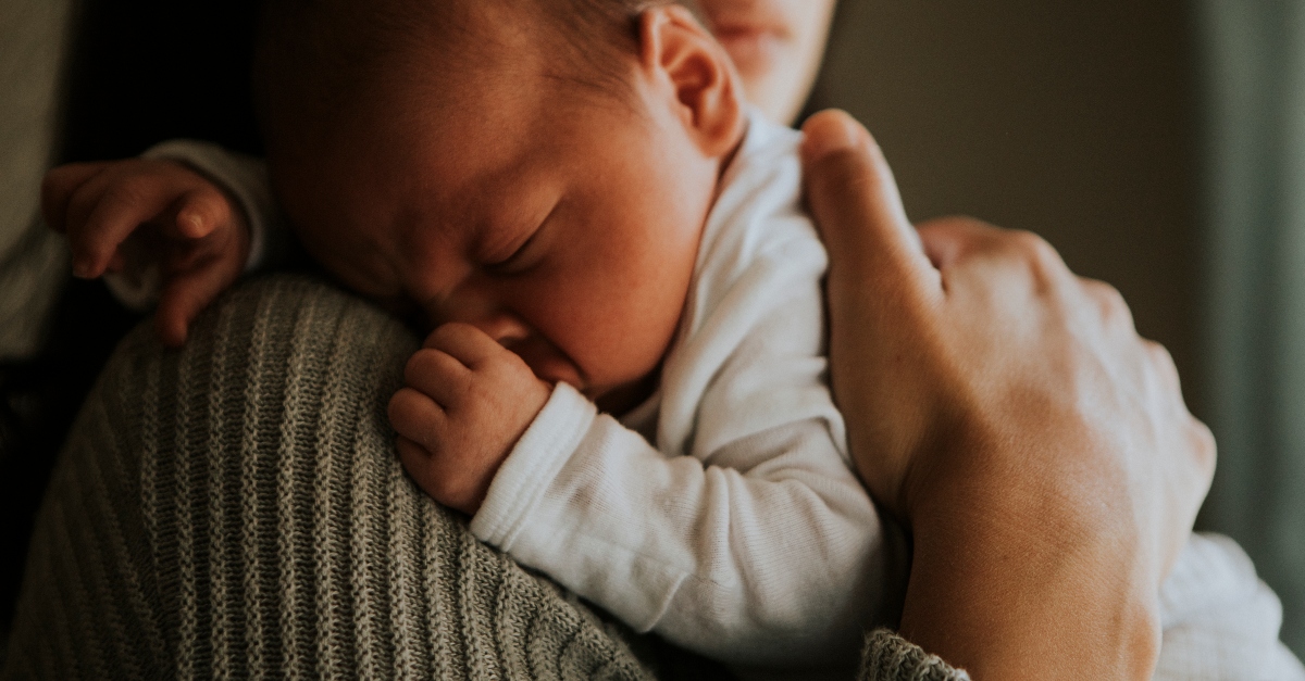 mother holding newborn baby