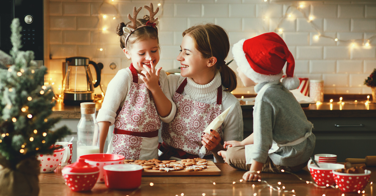 Happy mom and kids baking Christmas treats, Is Christmas Pagan?
