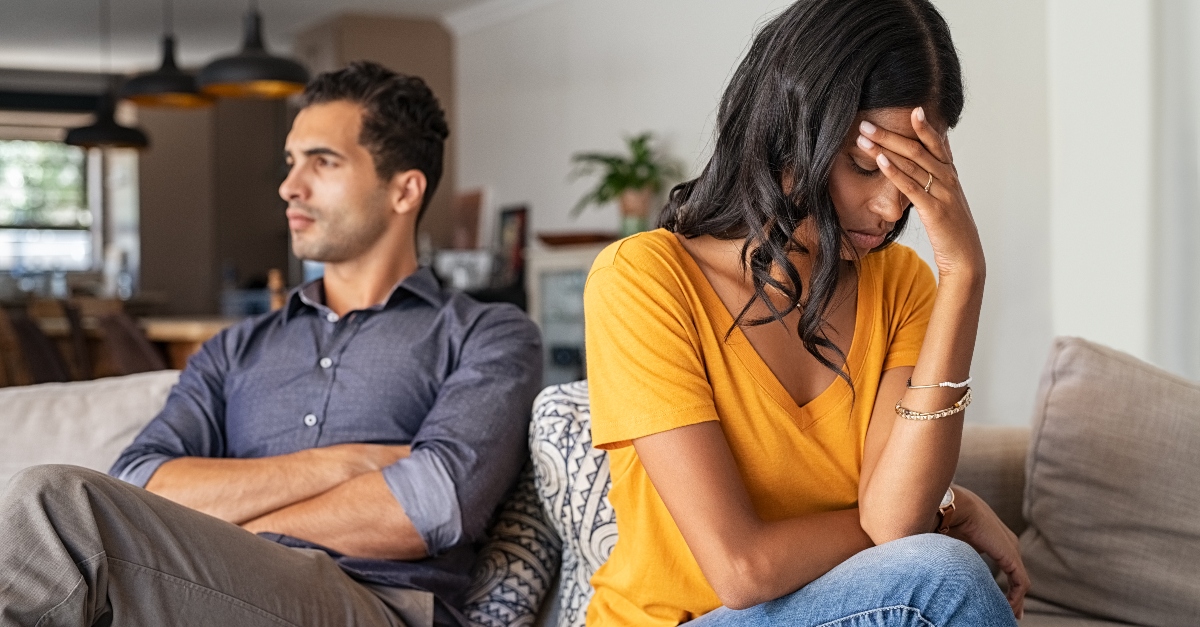 wife and husband upset with each other sitting on couch, when you fear youre not enough for spouse