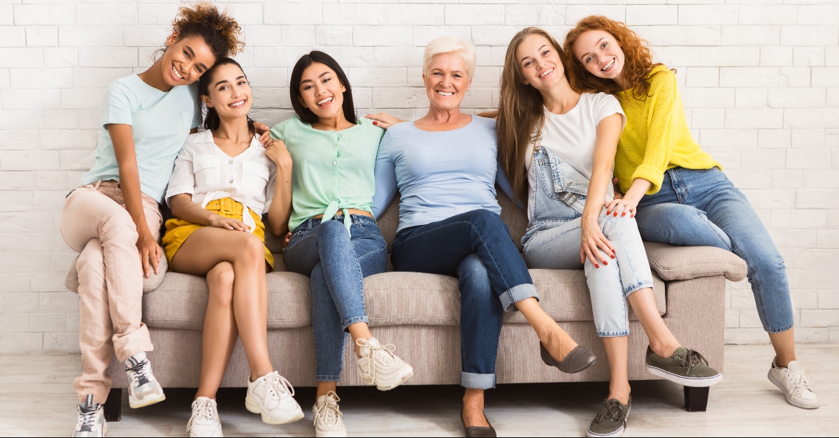 Women sitting on a couch together