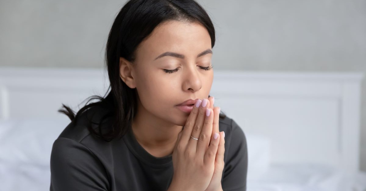 Close-up of a woman praying