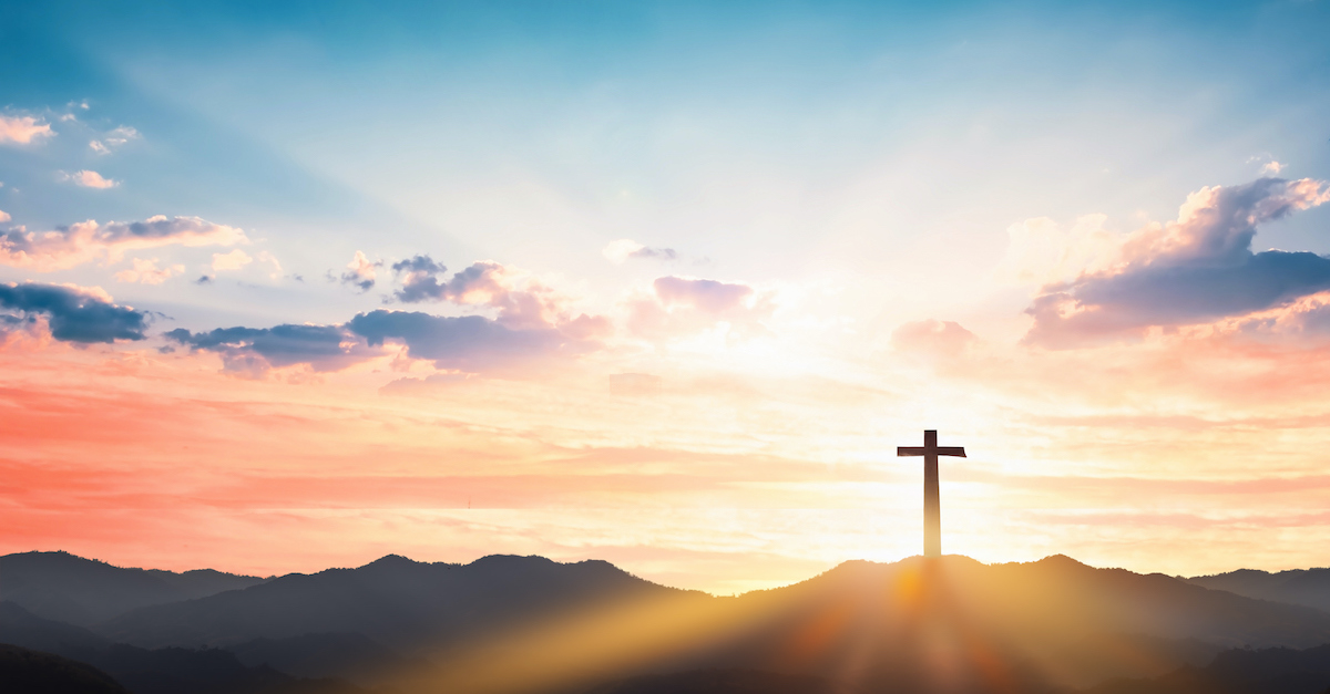 silhouette of Cross at sunset in beautiful scenic outdoors, Christianity beliefs