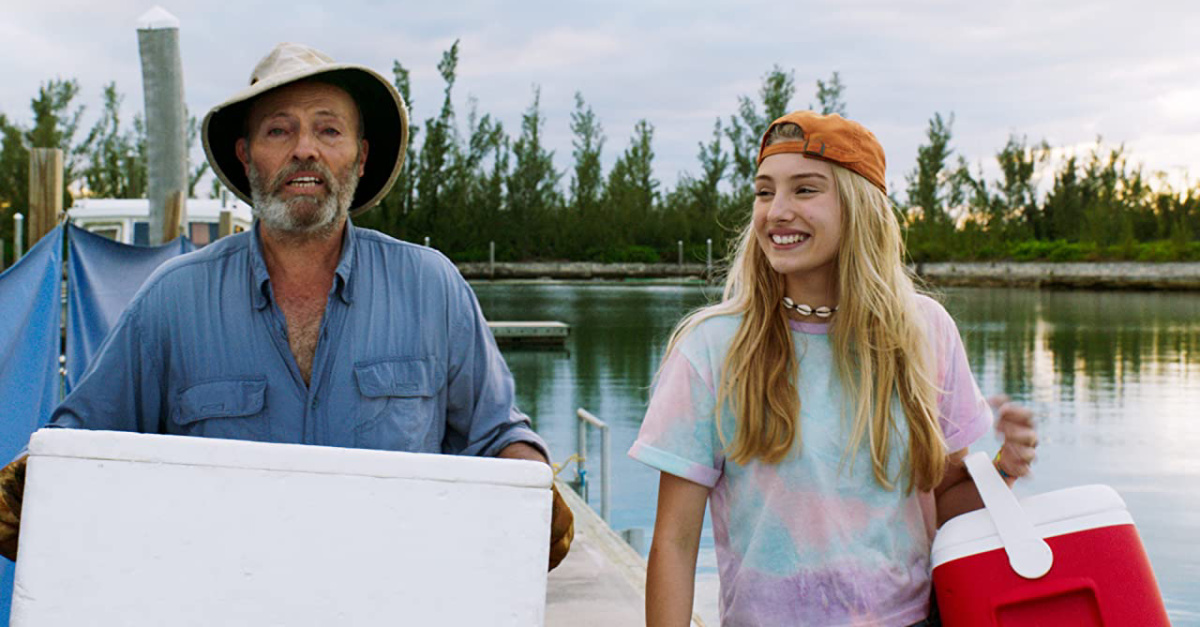 An older man and a young girl fishing in Dolphin Island