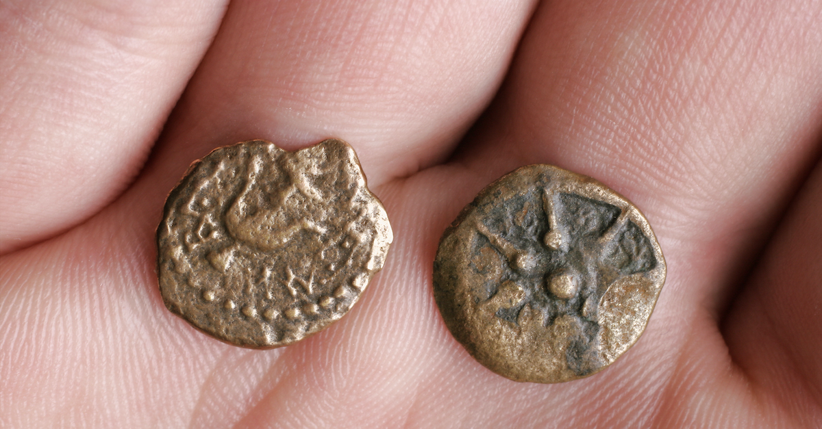 widows mite real coins from Roman times resting in palm of hand