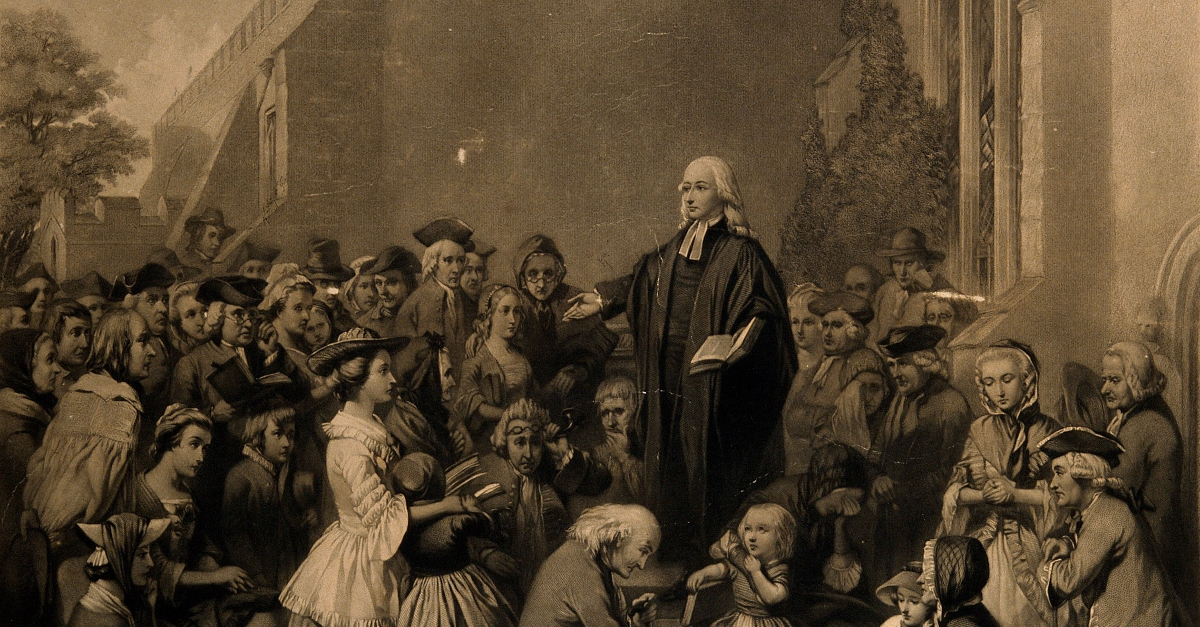 John Wesley teaching outside a church
