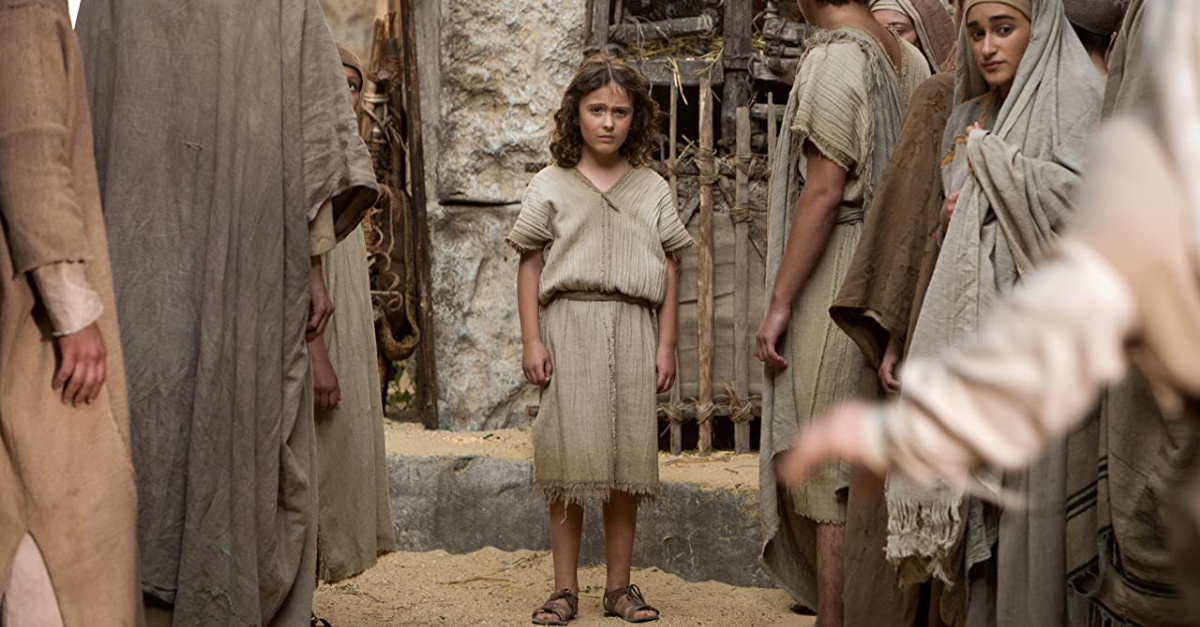 A small child looking concerned at the camera in Young Messiah