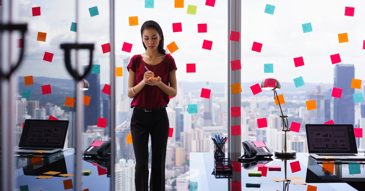 Woman surrounded by post-it notes