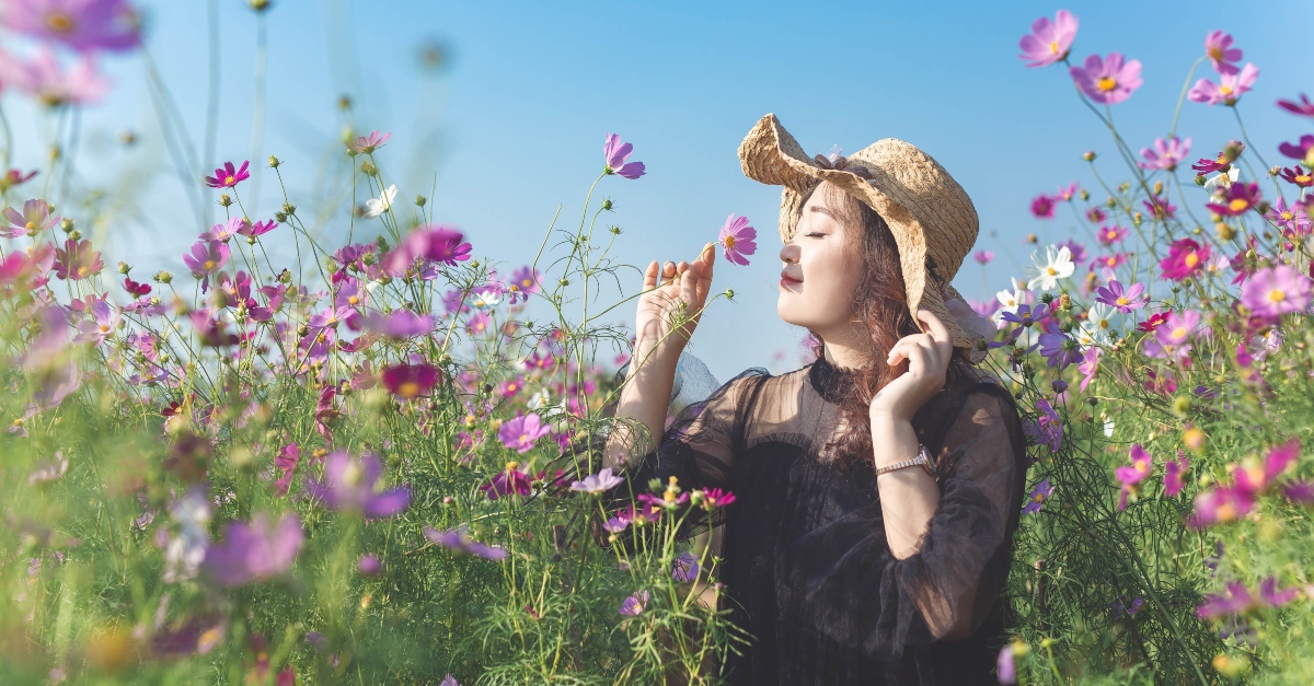 Woman smelling spring flowers