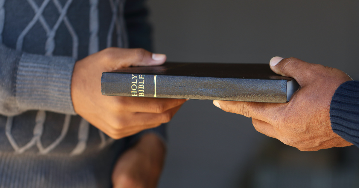Men sharing a bible, A win for religious free speech