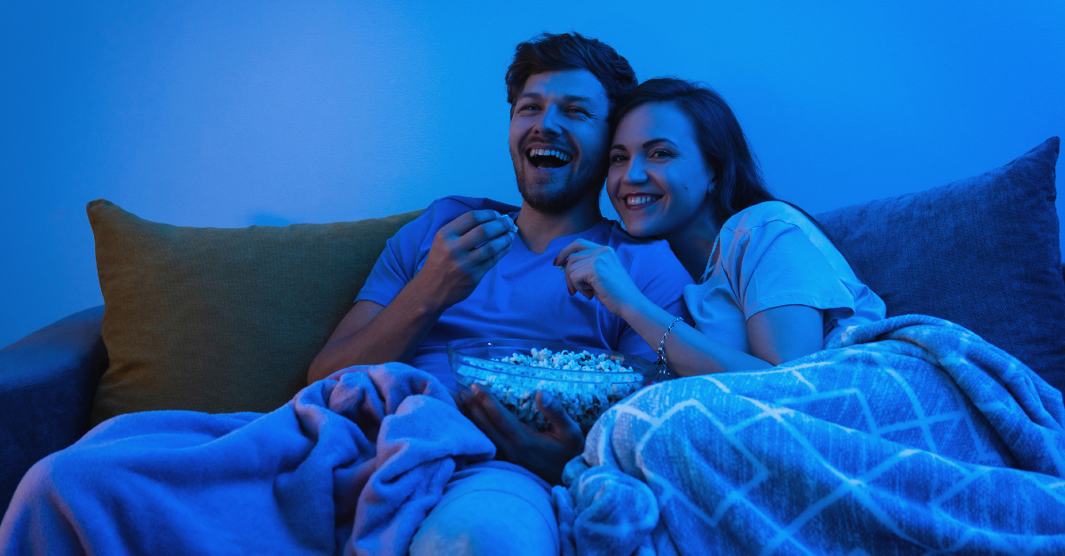 couple on couch watching a movie