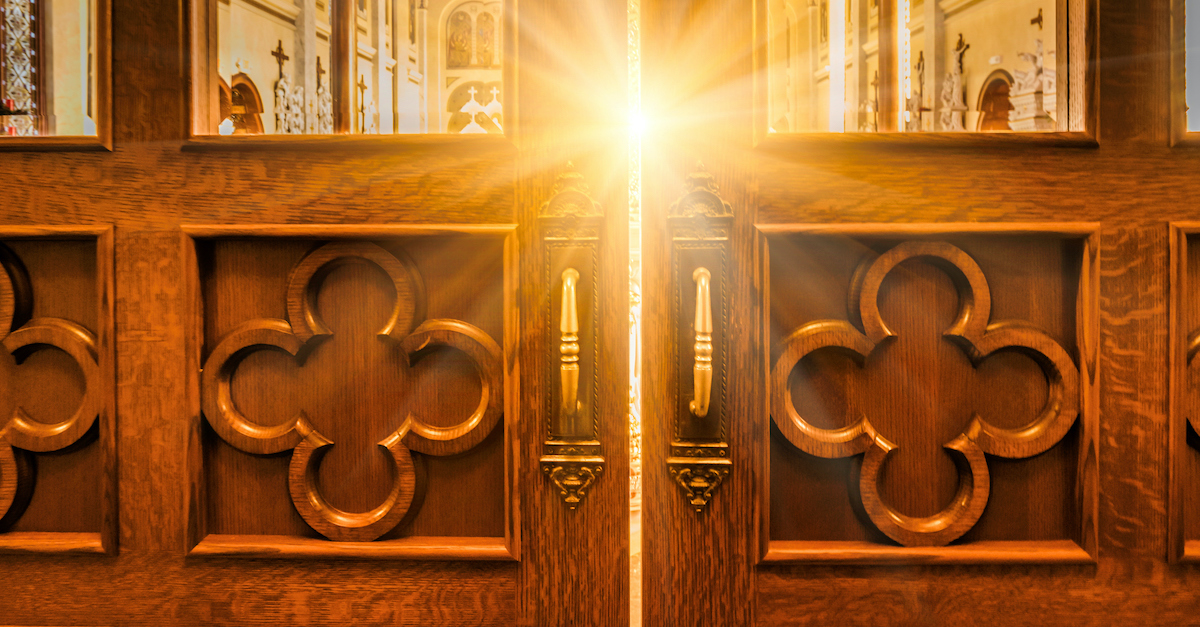 church doors with bright light shining through window, behold I stand at the door and knock