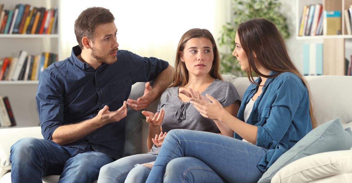 three people sitting on couch talking arguing meeting friends