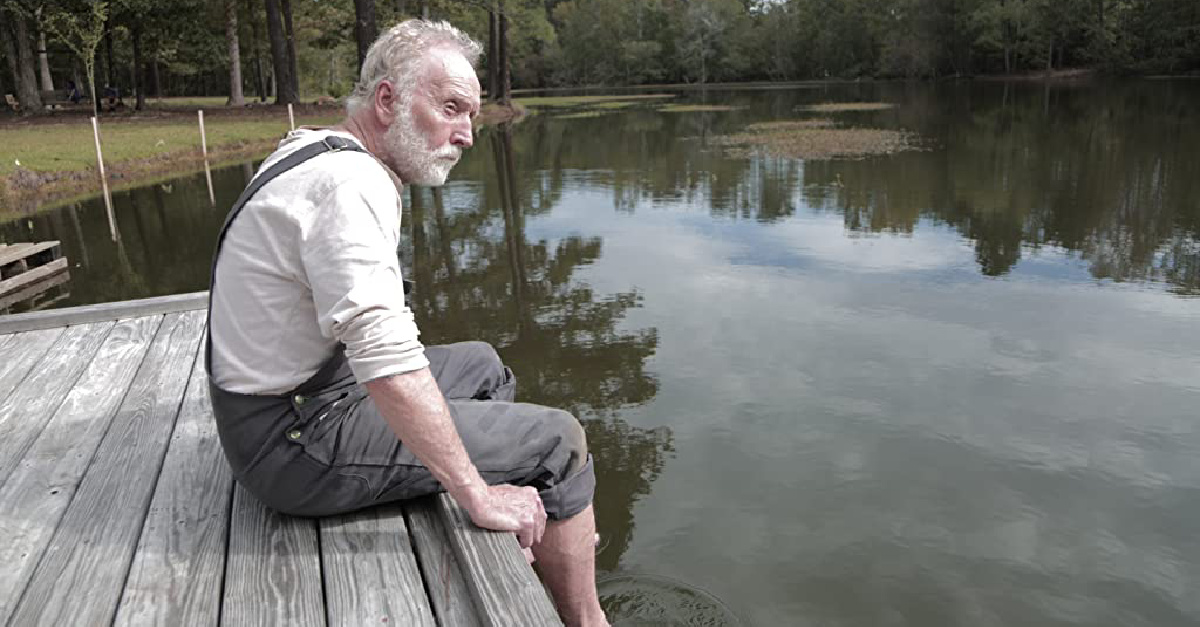 a man sitting on a dock, a new movie about a father's impact