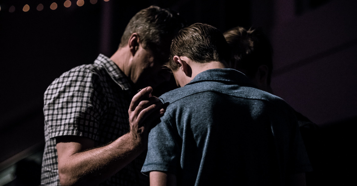 men praying, What the church can learn from AA