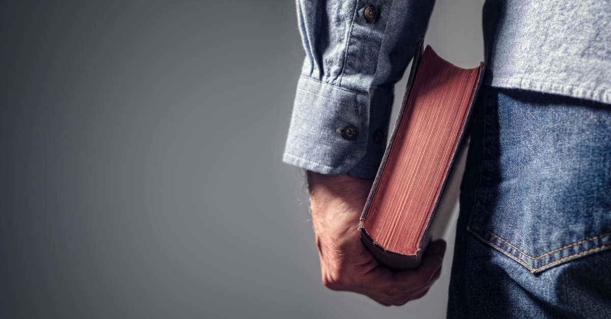 A man holding a Bible