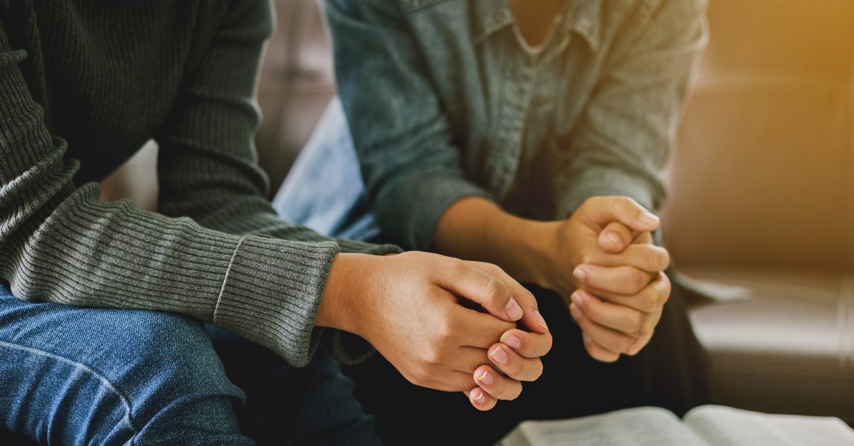 Two people praying