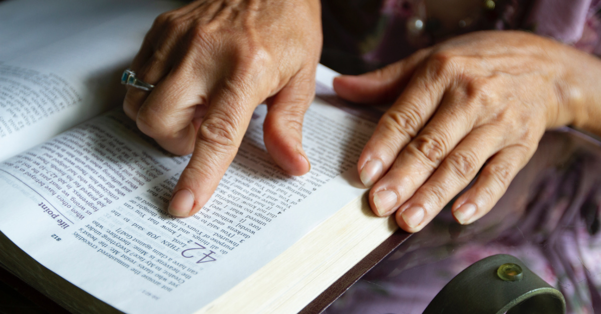 A hand following along in the Bible, The importance of seeking God's power over our Enemy