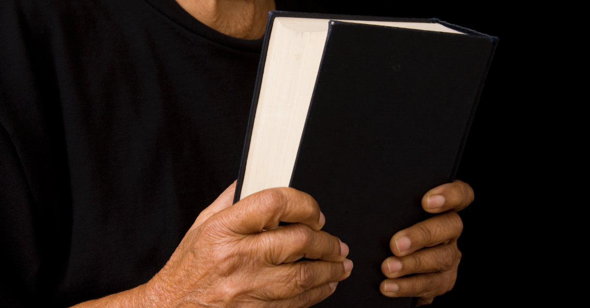 woman holding Bible, nearly 60 percent of woman report facing gender-based discrimination