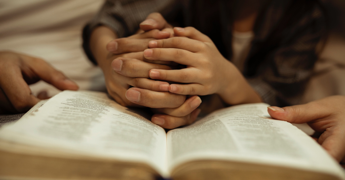 A mom and daughter reading a Bible, a young mom is shot to death while reading the Bible to her infant