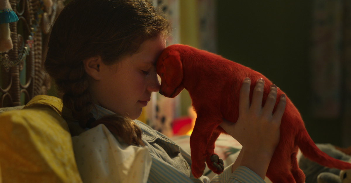 Emily holding Clifford as a small dog