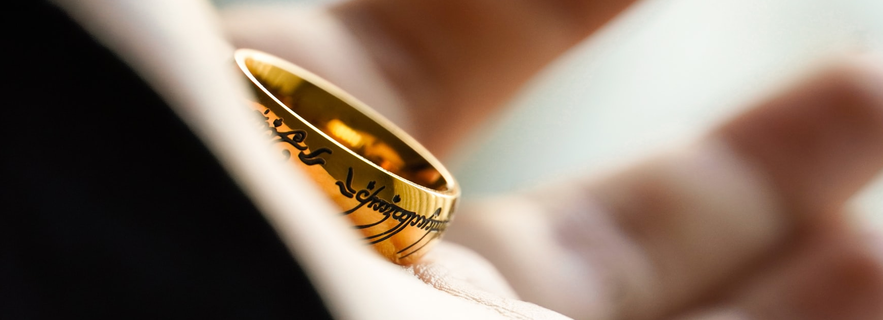 Hand holding Sauron's ring lord of the rings Christian themes