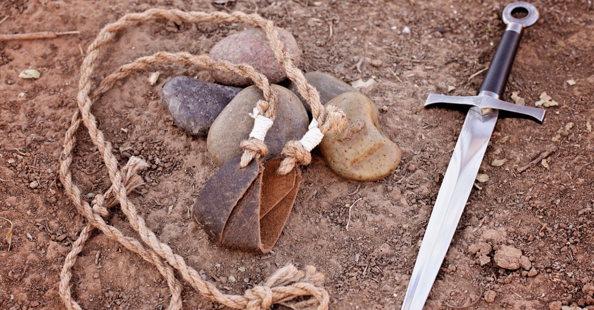 Slingshot with rocks and a sword, david vs golaith