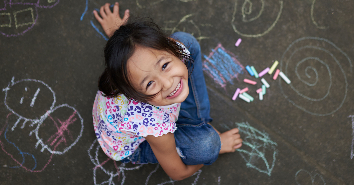 Girl playing with chalk