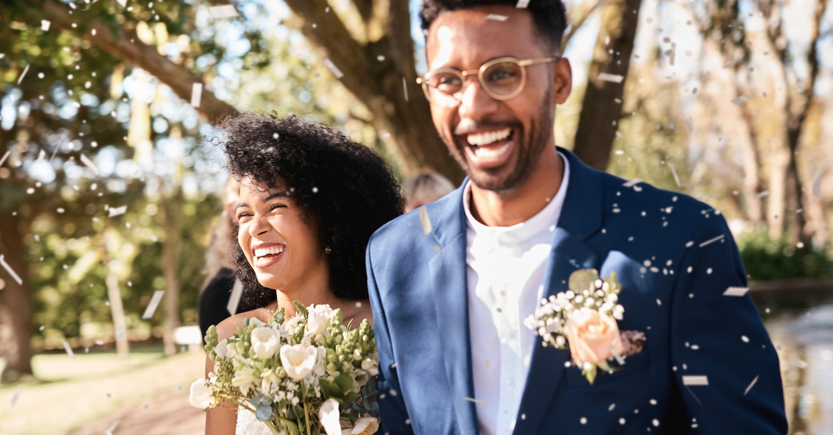 Bride and groom walking down the aisle after marriage