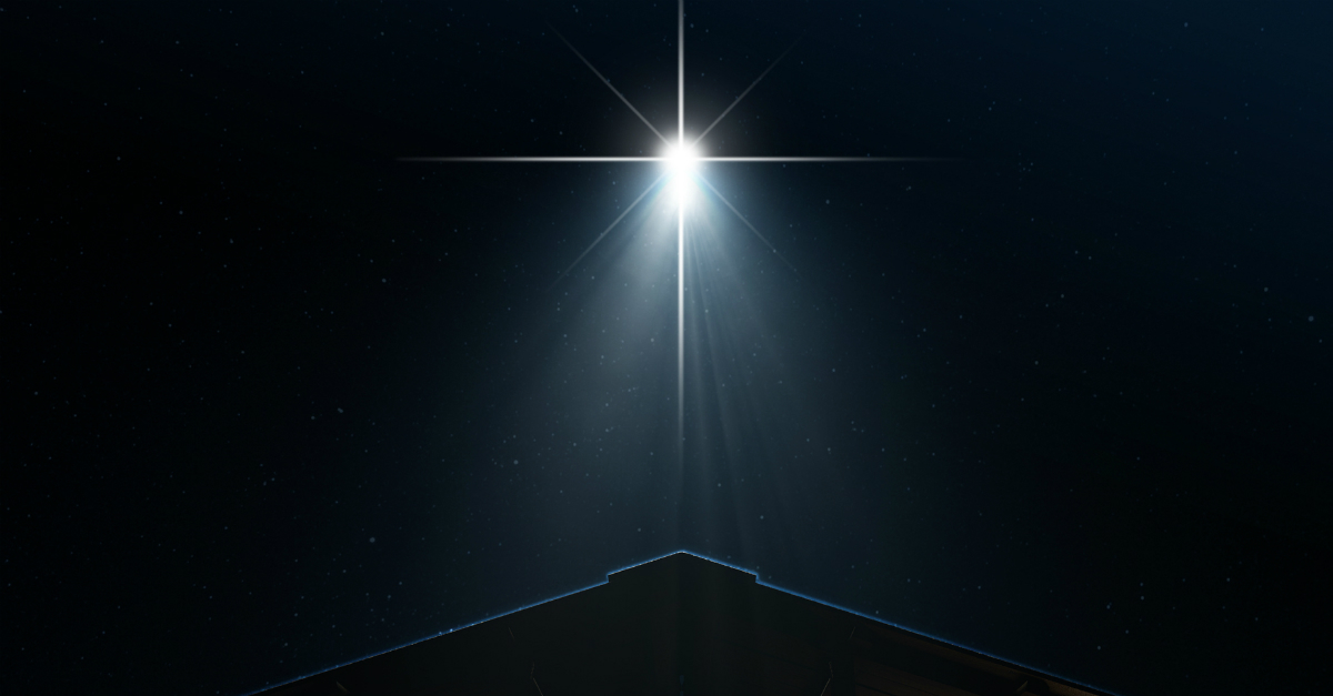 Christmas star of Bethlemen shining above roof