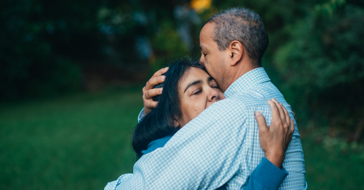 wife and husband hugging passionately in forgiveness