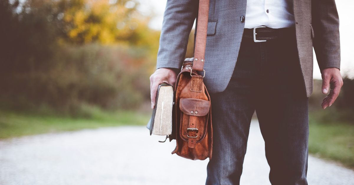 Pastor walking on a path