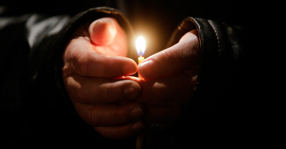 Person holding a candle -  the lord is my light and salvation meaning