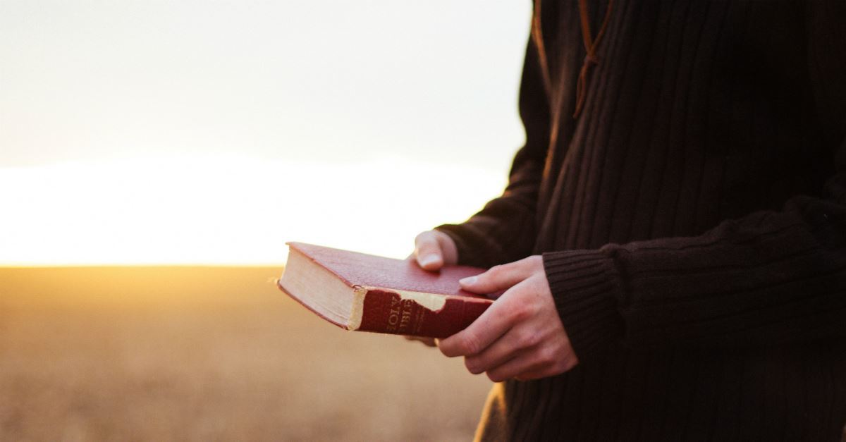 Man holding a Bible