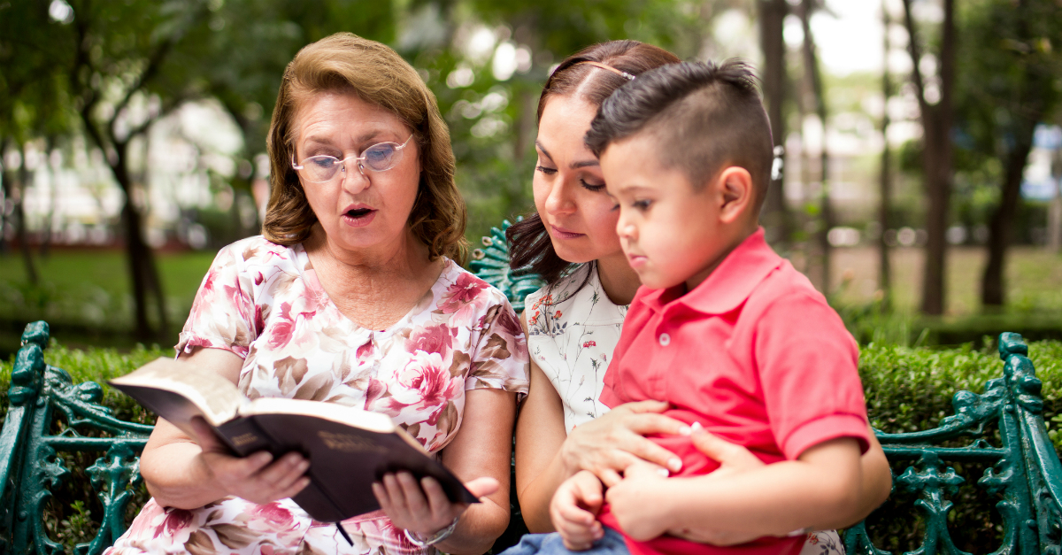 Grandma reading the Bible to her grandson