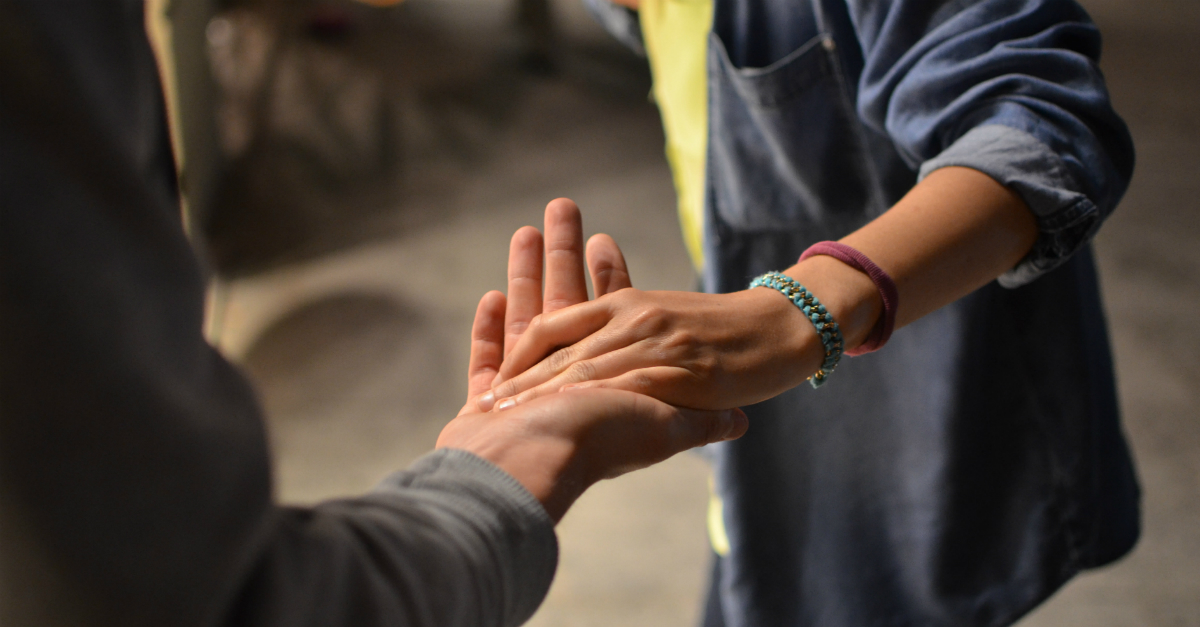 A young person offering a helping hand