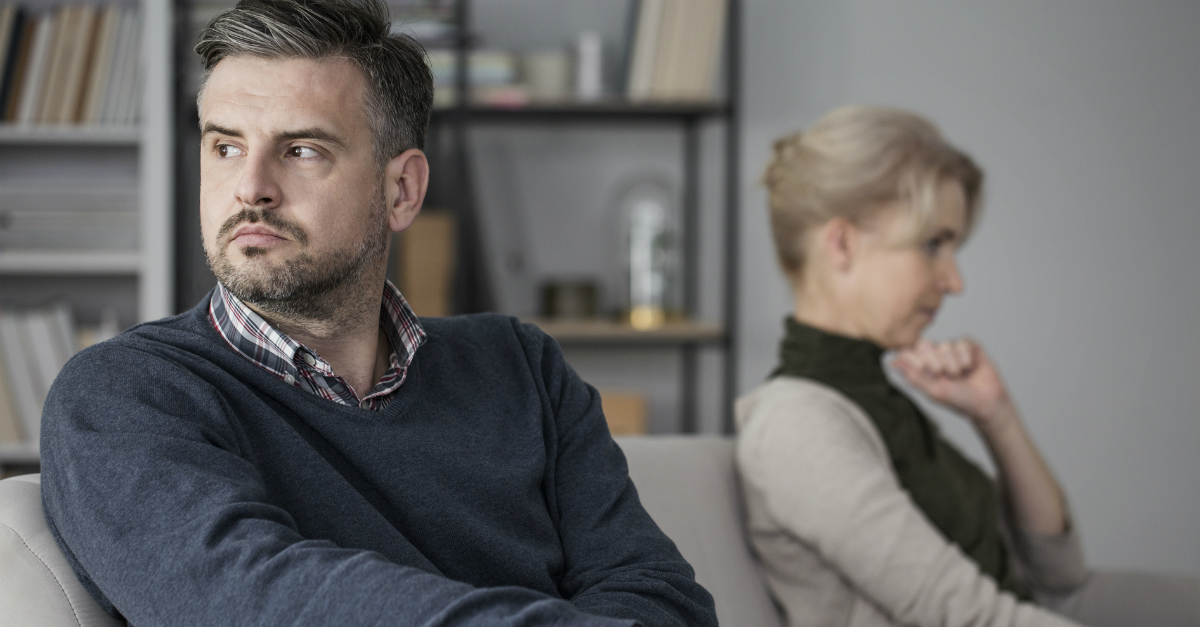 older couple looking upset with each other, whose fault is it i'm angry