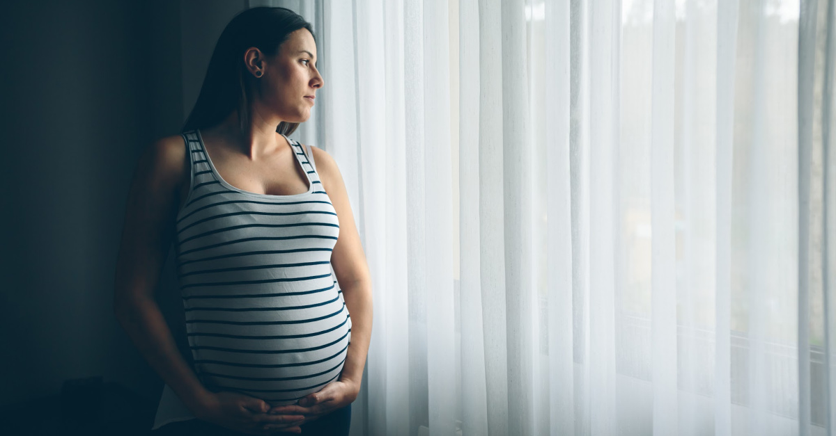 pregnant woman looking out window, prayers for pregnancy