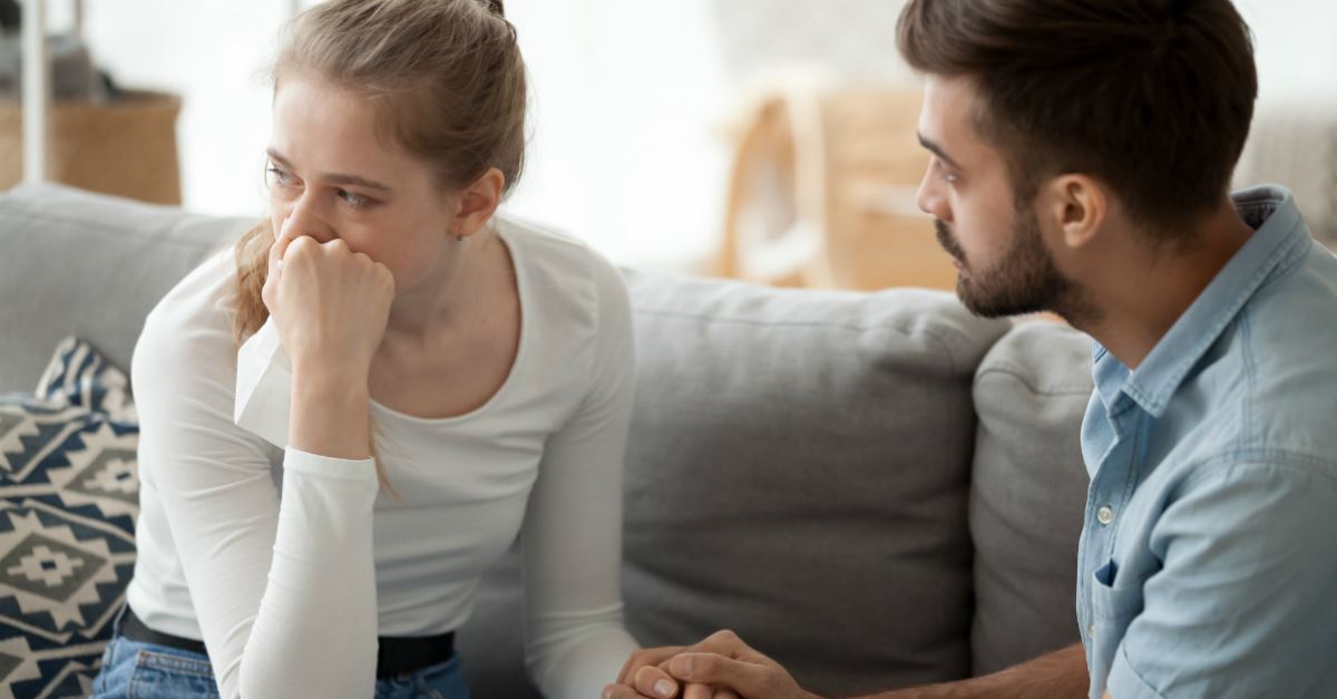 husband talking to wife who looks upset