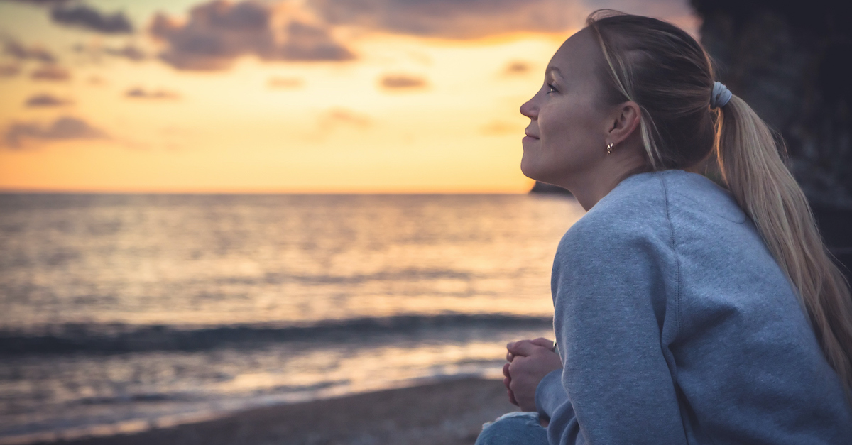 woman thinking on beach, bible verses about wisdom