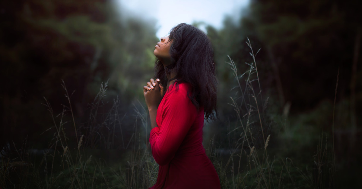 Woman praying outside