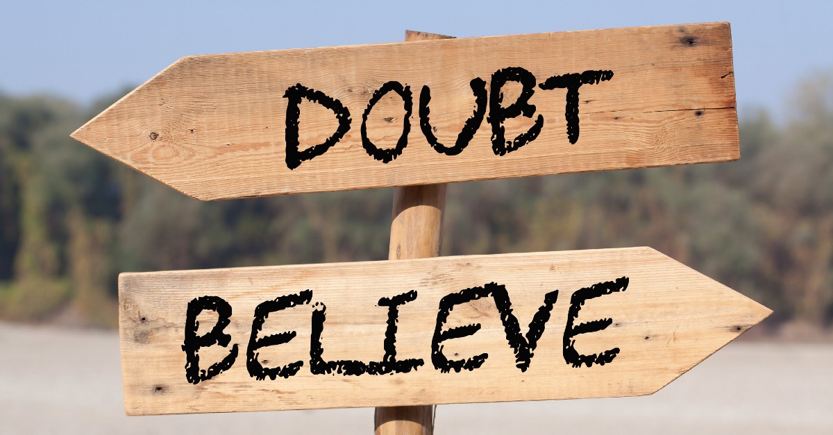directional signs pointing to doubt and believe